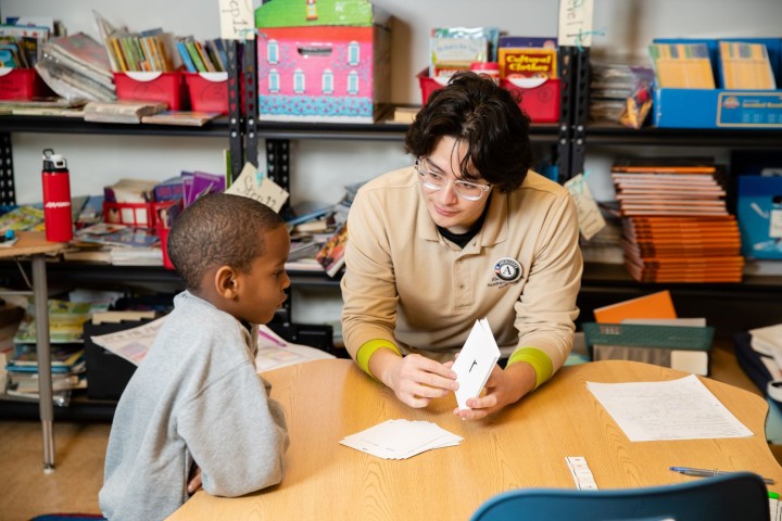 a Reading Assist tutor working with  a student.